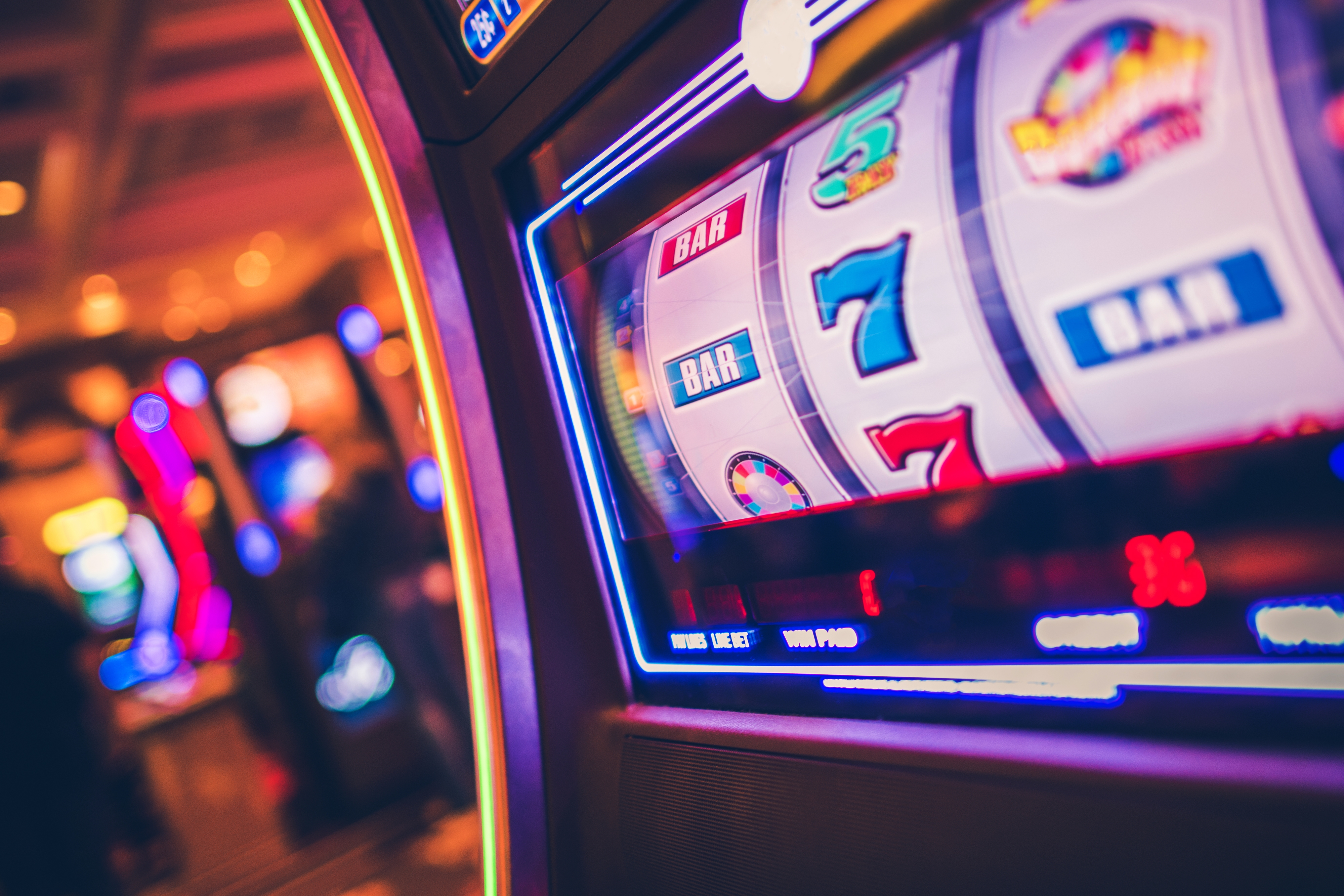 Close-up of a brightly illuminated casino slot machine